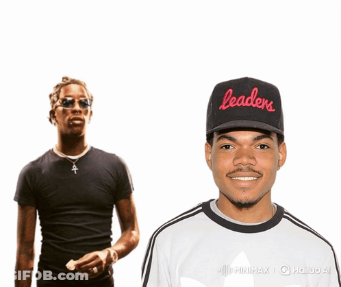 A Man Wearing A Black Hat That Says Leaders Stands Next To Another Man GIF