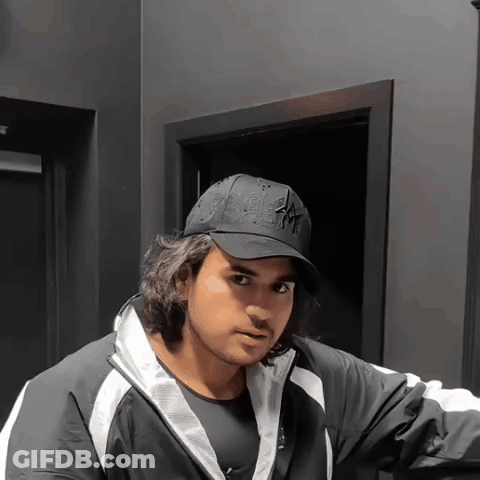 A Man Wearing A Black Hat That Says Ny GIF