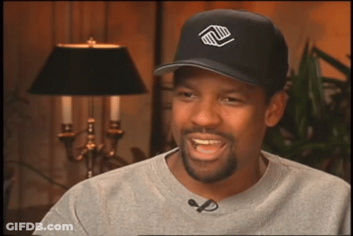 A Man Wearing A Black Hat With A Logo On It GIF