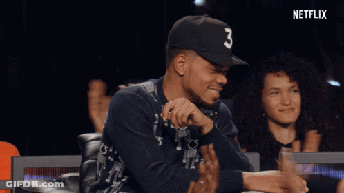 A Man Wearing A Black Hat With The Number Three On It GIF