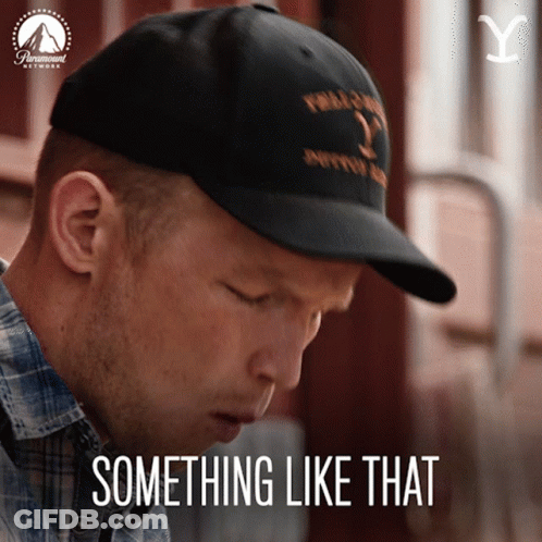 A Man Wearing A Black Hat With The Words Something Like That On It GIF