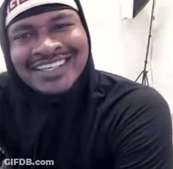 A Man Wearing A Black Hoodie And A Hat With The Letter G On It GIF