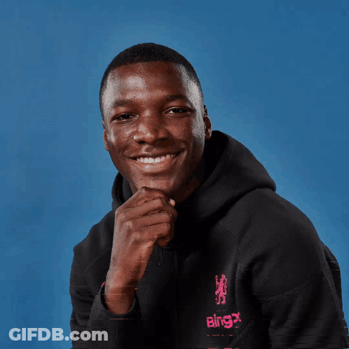 A Man Wearing A Black Hoodie That Says Bingx On It GIF
