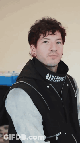 A Man Wearing A Black Hoodie That Says Daremore On It GIF