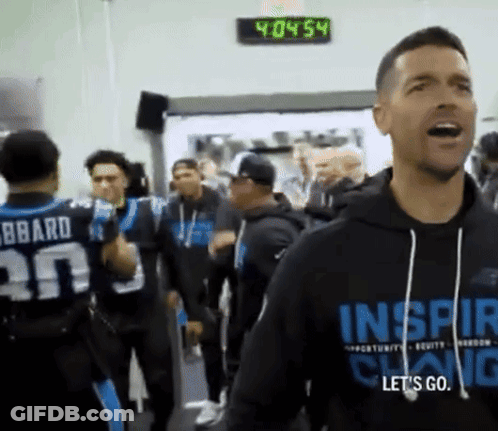 A Man Wearing A Black Hoodie That Says Inspire GIF
