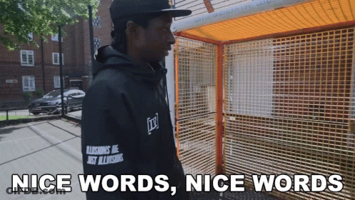 A Man Wearing A Black Hoodie That Says " Nice Words Nice Words " GIF