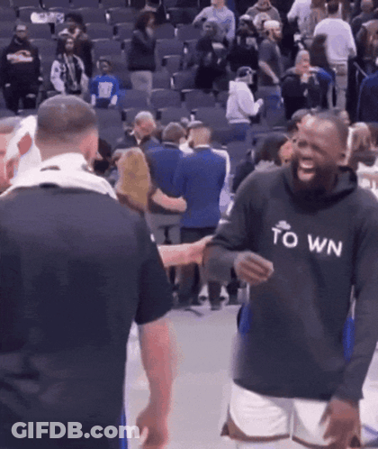 A Man Wearing A Black Hoodie That Says Town GIF