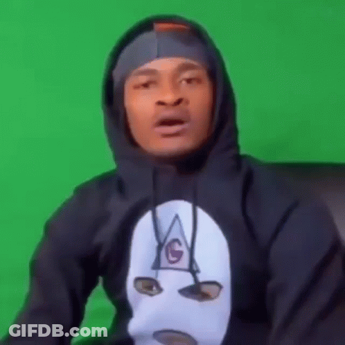 A Man Wearing A Black Hoodie With A Mask On His Face . GIF