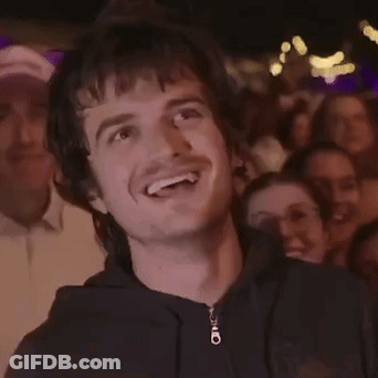 A Man Wearing A Black Hoodie With A Zipper That Says ' O ' On It GIF