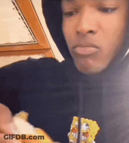 A Man Wearing A Black Hoodie With Spongebob On It GIF