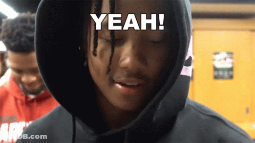 A Man Wearing A Black Hoodie With The Word Yeah On His Face GIF