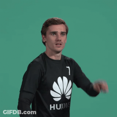 A Man Wearing A Black Huawei Shirt Is Pointing GIF