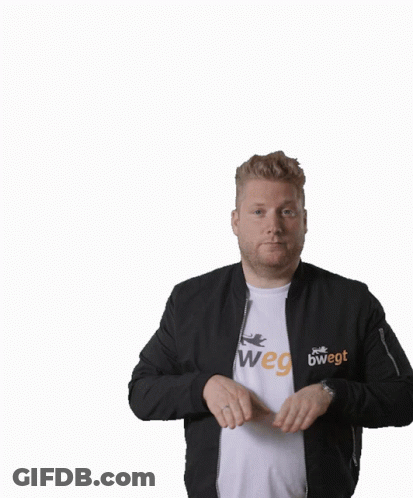 A Man Wearing A Black Jacket And A White Shirt Has His Arms In The Air GIF