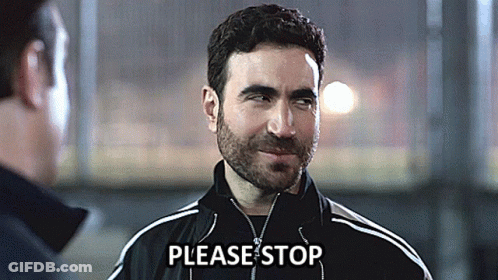 A Man Wearing A Black Jacket Says Please Stop In Front Of Another Man GIF