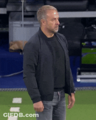 A Man Wearing A Black Jacket Stands On A Field GIF