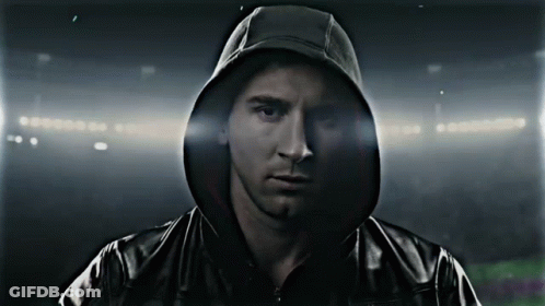 A Man Wearing A Black Jacket With A Hood GIF