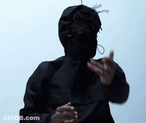 A Man Wearing A Black Jacket With A Hood On His Face GIF