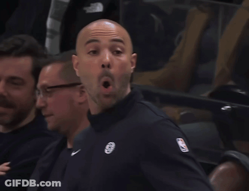 A Man Wearing A Black Jacket With A NBA Logo On The Sleeve GIF