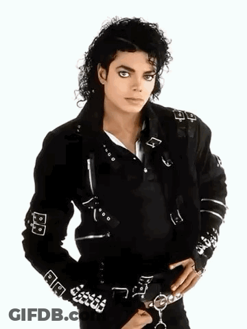 A Man Wearing A Black Jacket With The Letter A On The Sleeves GIF