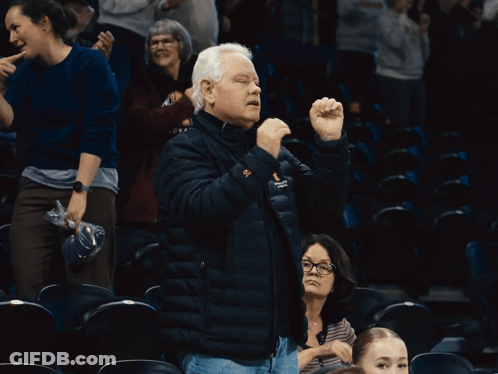 A Man Wearing A Black Jacket With The Word Columbia On The Sleeve GIF
