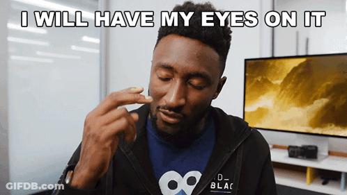 A Man Wearing A Black Jacket With The Words " I Will Have My Eyes On It " GIF