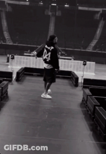 A Man Wearing A Black Jersey With The Number 04 On The Back GIF