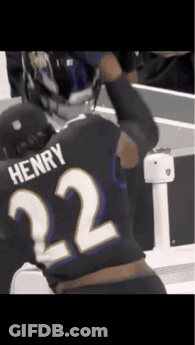 A Man Wearing A Black Jersey With The Number 22 On It GIF