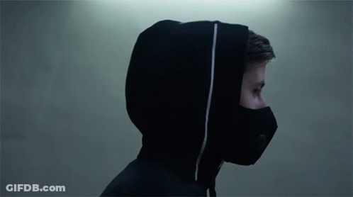 A Man Wearing A Black Mask And A Hooded Jacket GIF