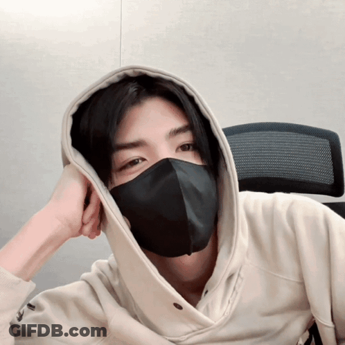 A Man Wearing A Black Mask And A Hoodie GIF
