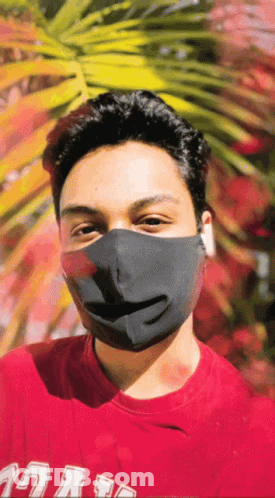 A Man Wearing A Black Mask And A Red Shirt That Says ' Uc San Diego ' On It GIF