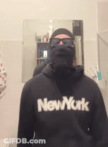 A Man Wearing A Black New York Sweatshirt GIF