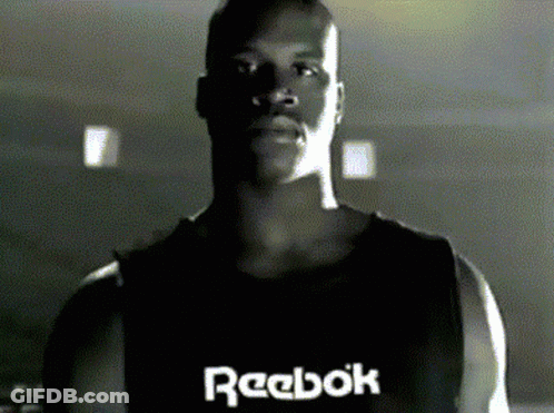 A Man Wearing A Black Reebok Tank Top GIF