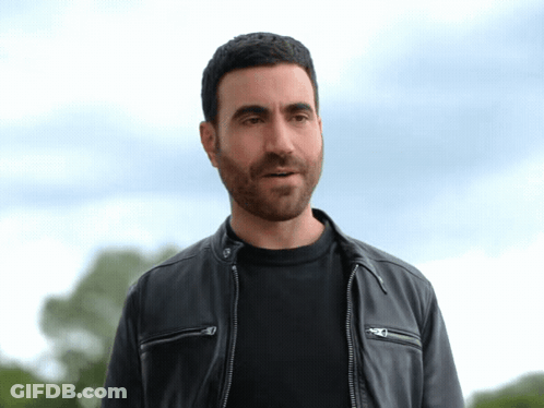 A Man Wearing A Black Shirt And A Black Leather Jacket GIF