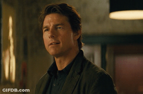 A Man Wearing A Black Shirt And A Brown Jacket GIF