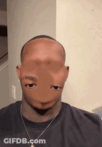 A Man Wearing A Black Shirt And A Necklace Has A Strange Face GIF