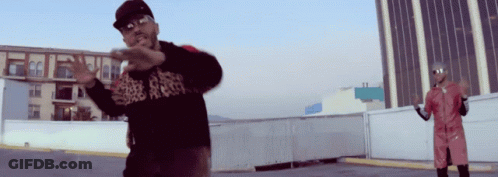 A Man Wearing A Black Shirt That Says ' A ' On It GIF