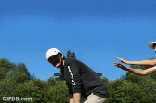 A Man Wearing A Black Shirt That Says " America " On The Arm GIF