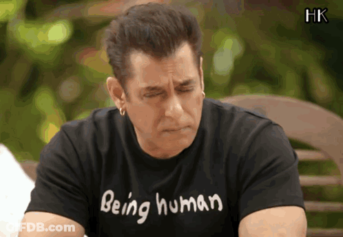 A Man Wearing A Black Shirt That Says Being Human On It GIF