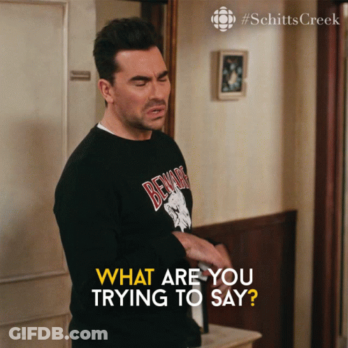 A Man Wearing A Black Shirt That Says Beware Is Asking What Are You Trying To Say GIF