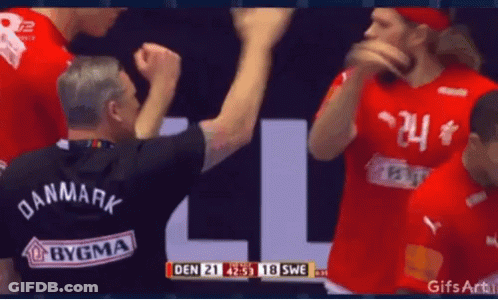 A Man Wearing A Black Shirt That Says Den On It GIF