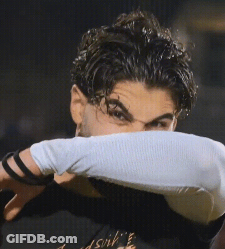 A Man Wearing A Black Shirt That Says ' Dsvih ' On It GIF