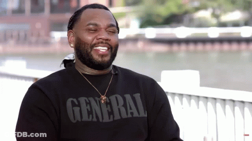 A Man Wearing A Black Shirt That Says General GIF