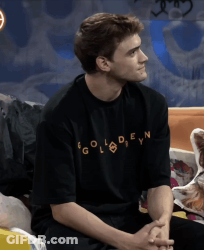 A Man Wearing A Black Shirt That Says Golden GIF