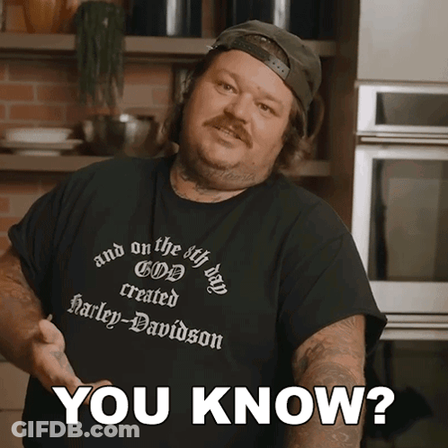 A Man Wearing A Black Shirt That Says Harley Davidson GIF