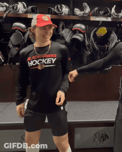 A Man Wearing A Black Shirt That Says Hockey GIF