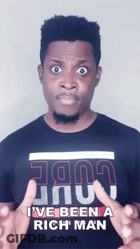 A Man Wearing A Black Shirt That Says I Ve Been A Rich Man GIF