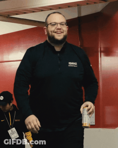 A Man Wearing A Black Shirt That Says Idaho GIF