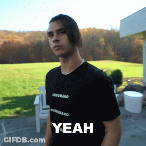 A Man Wearing A Black Shirt That Says Inhumano On It GIF
