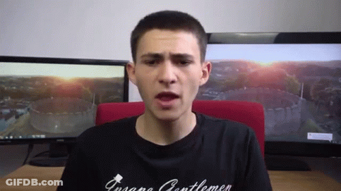 A Man Wearing A Black Shirt That Says ' Insane Gentlemen ' GIF