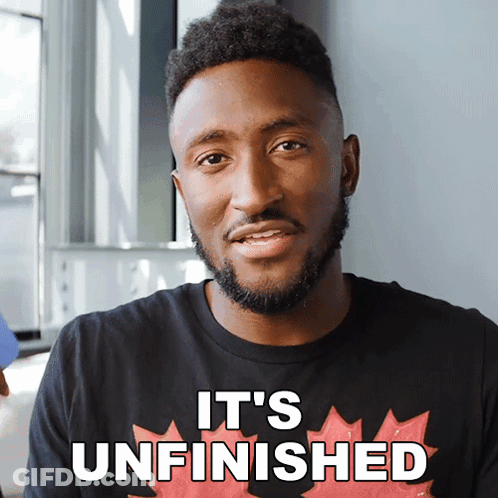 A Man Wearing A Black Shirt That Says It 'S Unfinished On It GIF